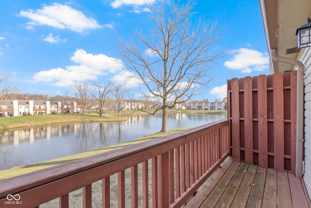 wooden deck featuring a water view