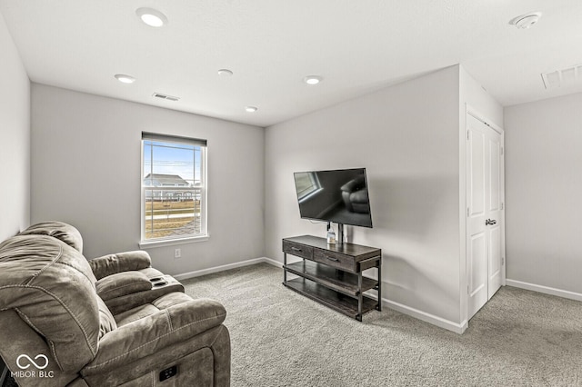 carpeted living room with baseboards, visible vents, and recessed lighting