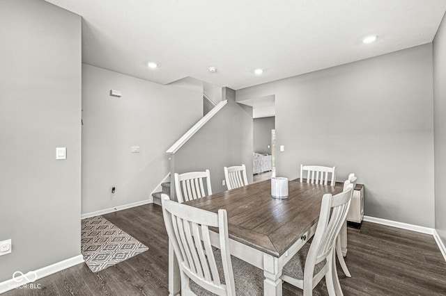 dining space featuring stairs, baseboards, wood finished floors, and recessed lighting