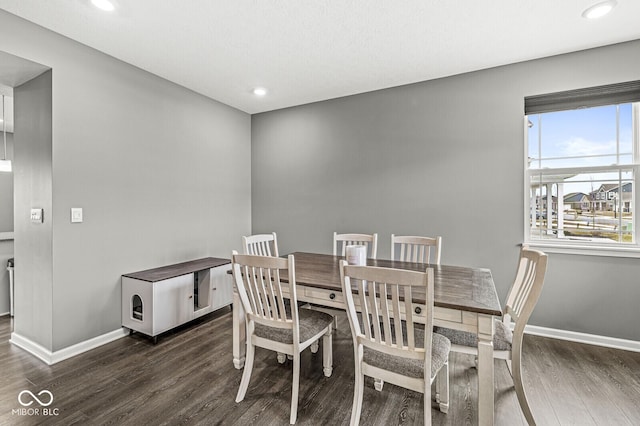 dining area featuring dark wood-style flooring, recessed lighting, and baseboards