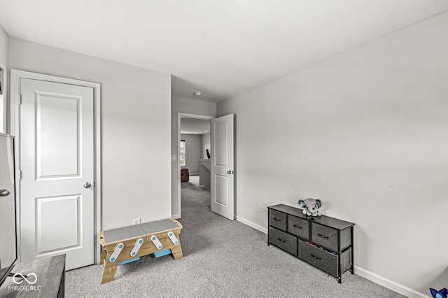 bedroom with carpet flooring and baseboards