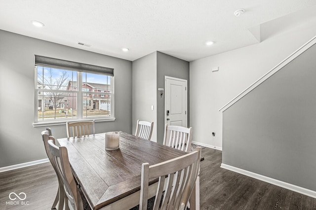 dining area with recessed lighting, wood finished floors, and baseboards