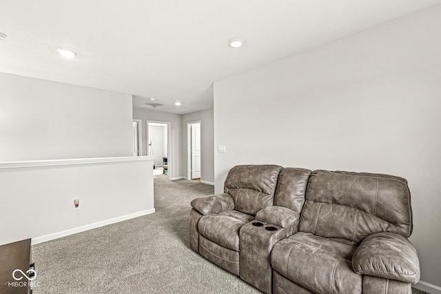 carpeted living room featuring baseboards and recessed lighting