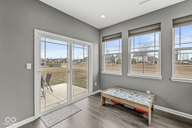 entryway featuring wood finished floors and baseboards