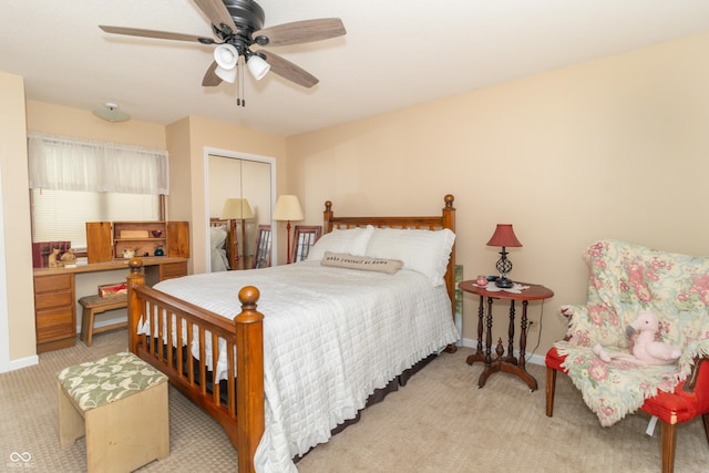 bedroom featuring light carpet, baseboards, a ceiling fan, and a closet