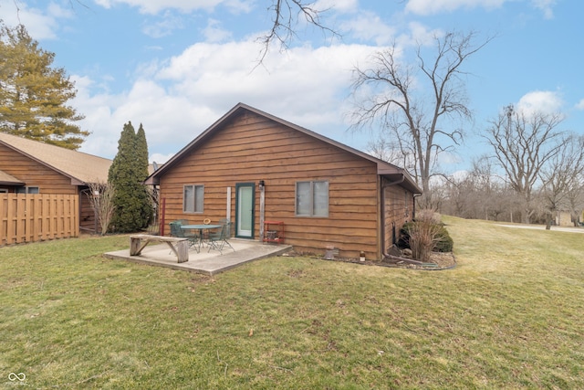 rear view of property with a patio area, a lawn, and fence