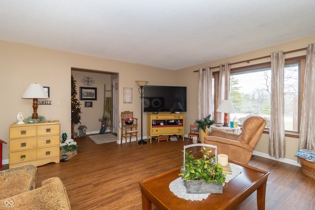 living area featuring wood finished floors and baseboards