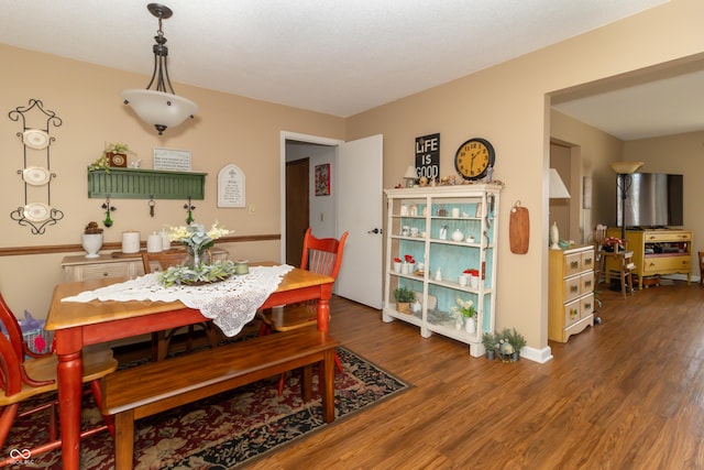 dining room with wood finished floors