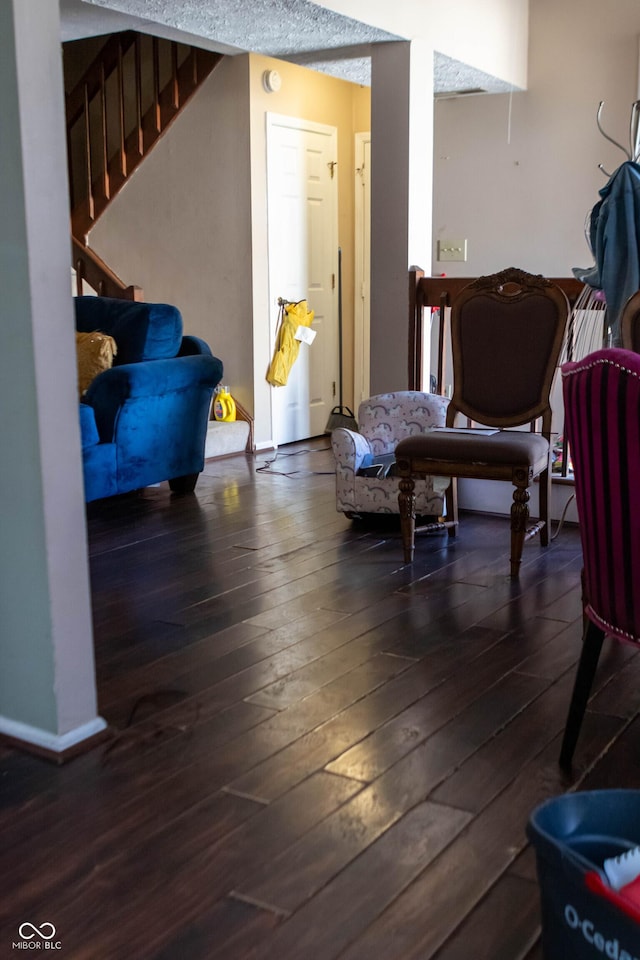 interior space featuring stairway, baseboards, and hardwood / wood-style floors