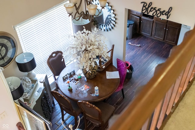 dining area with a chandelier and hardwood / wood-style flooring