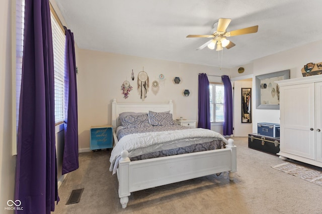 bedroom featuring carpet, visible vents, and ceiling fan