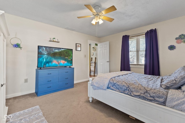 bedroom featuring carpet flooring, ceiling fan, a textured ceiling, and baseboards