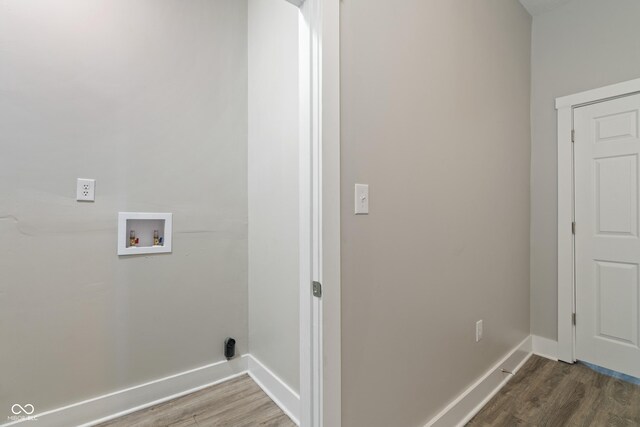 569 N Tacoma Ave, Indianapolis, IN 46201 - laundry room featuring wood finished floors, baseboards, and washer hookup
