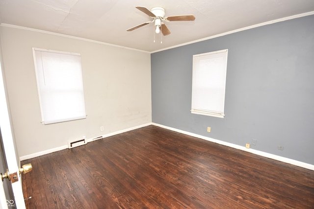 spare room with baseboards, ornamental molding, and wood finished floors