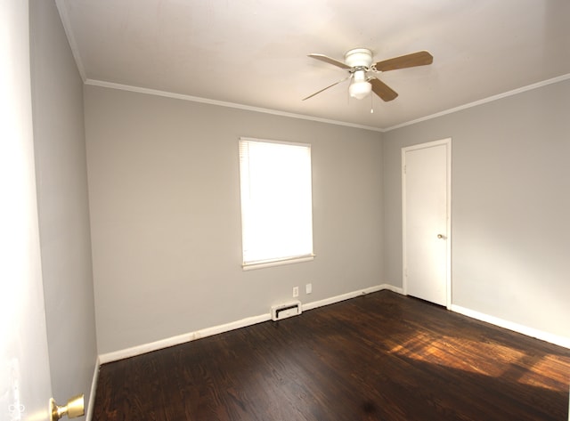 unfurnished room with baseboards, dark wood finished floors, and crown molding