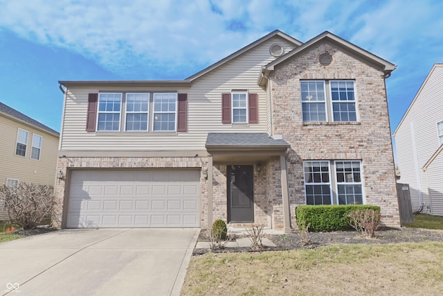 traditional-style house with concrete driveway, brick siding, and an attached garage