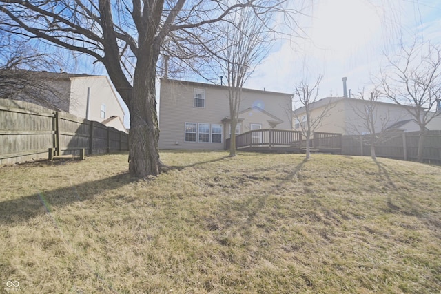 view of yard with a deck and a fenced backyard