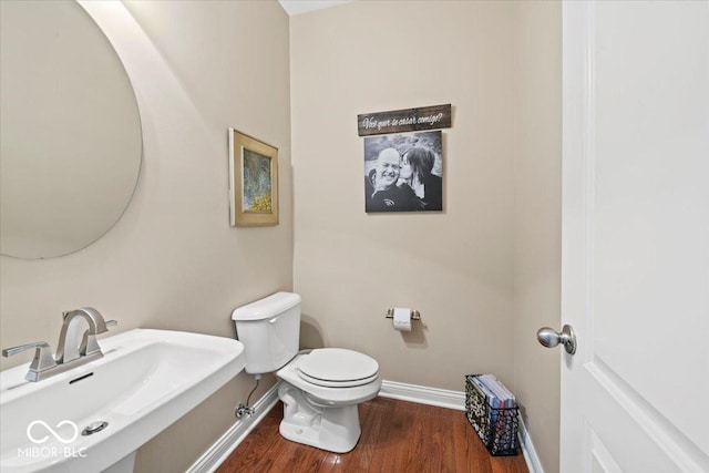 681 Greenford Trl N, Carmel, IN 46032 - bathroom featuring a sink and wood finished floors