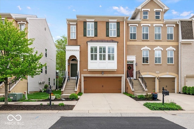 681 Greenford Trl N, Carmel, IN 46032 - view of front of property with driveway, an attached garage, and brick siding