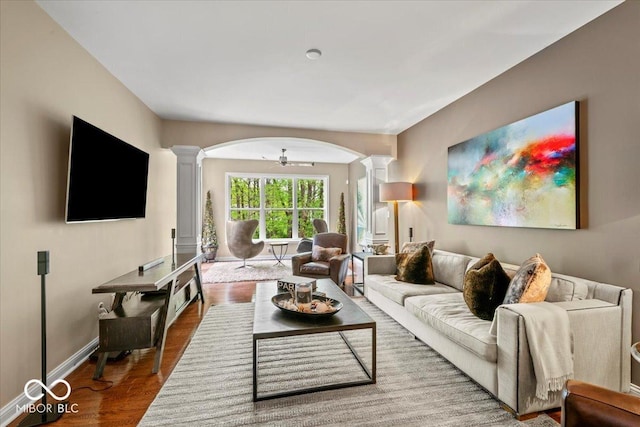 681 Greenford Trl N, Carmel, IN 46032 - living area with ornate columns, arched walkways, and wood finished floors