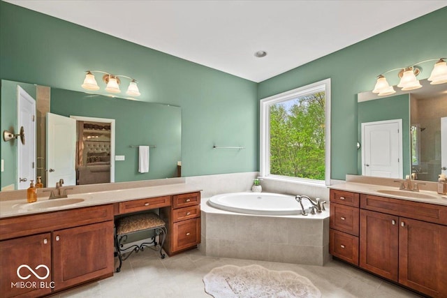 681 Greenford Trl N, Carmel, IN 46032 - bathroom with two vanities, tile patterned floors, a bath, and a shower stall