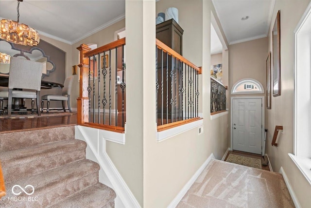 681 Greenford Trl N, Carmel, IN 46032 - foyer featuring stairway, a chandelier, and crown molding