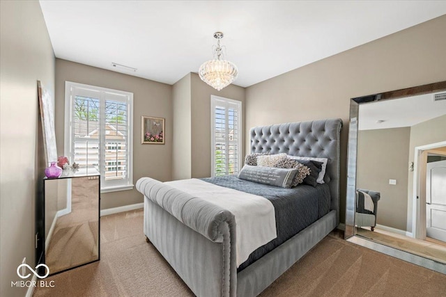 681 Greenford Trl N, Carmel, IN 46032 - bedroom with carpet floors, multiple windows, and a chandelier