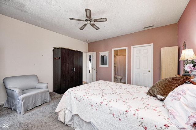 bedroom with visible vents, carpet, ceiling fan, and a textured ceiling