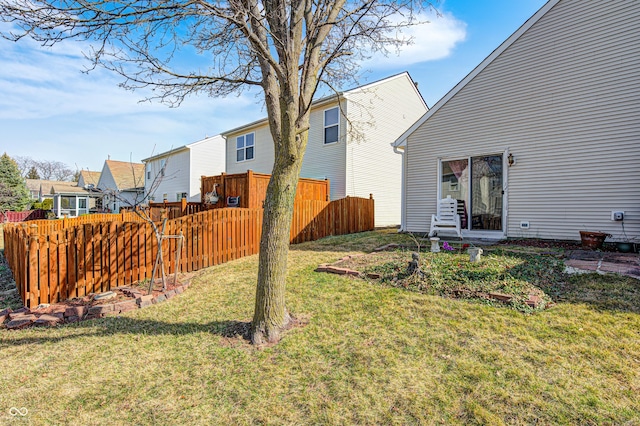 view of yard featuring a residential view and fence