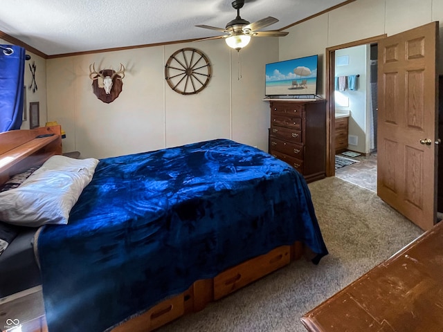 carpeted bedroom featuring a textured ceiling, crown molding, and a ceiling fan