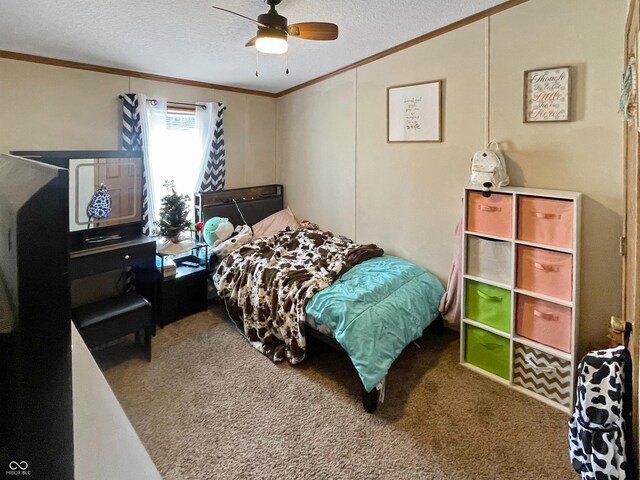 bedroom with crown molding, carpet floors, and a textured ceiling