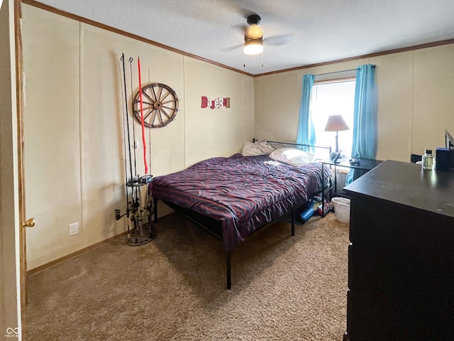 carpeted bedroom featuring a ceiling fan, a textured ceiling, and crown molding