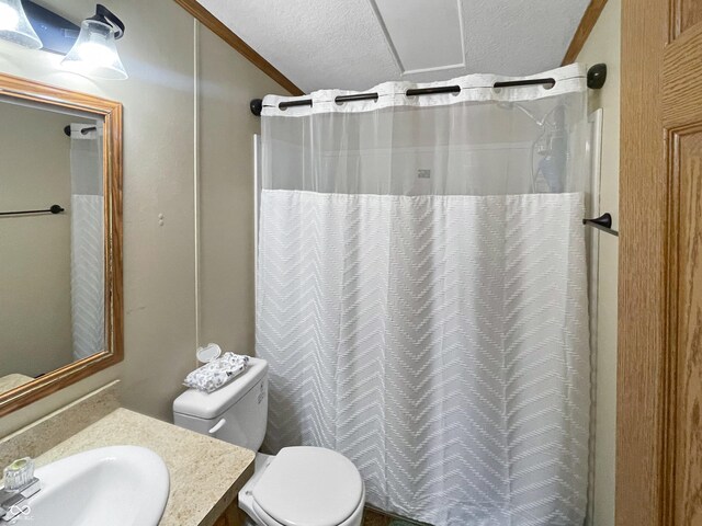 full bathroom with a shower with curtain, a textured ceiling, vanity, and toilet