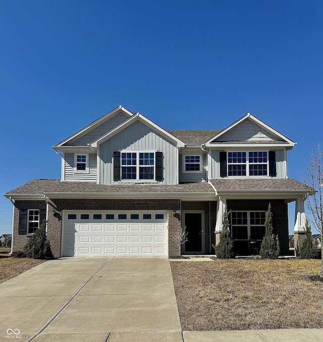 view of front of home featuring brick siding, board and batten siding, concrete driveway, and an attached garage