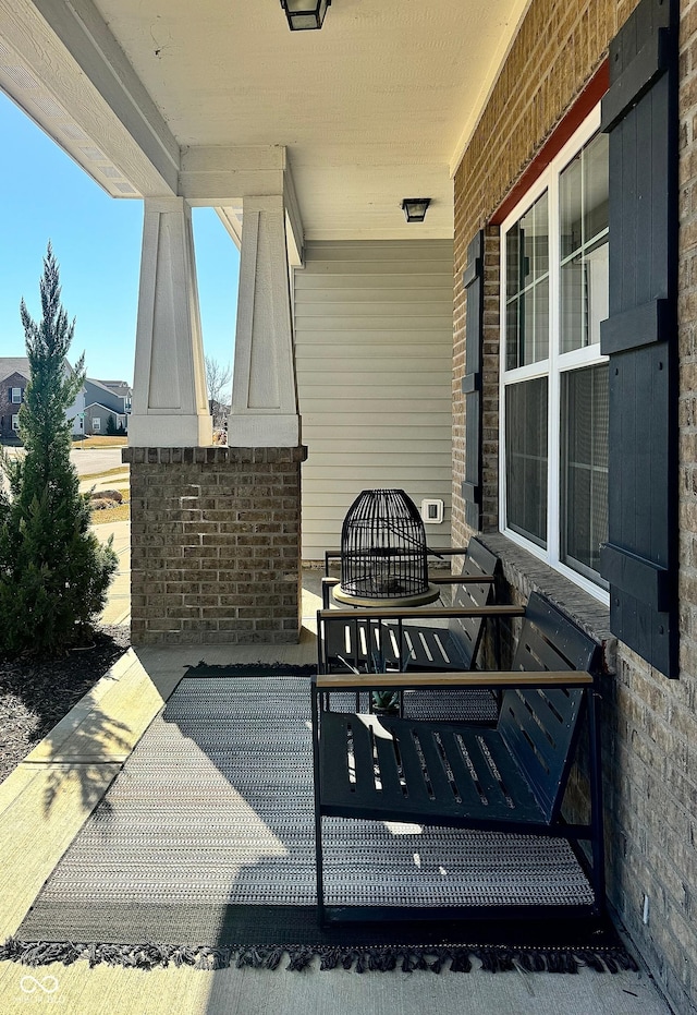 view of patio featuring a porch