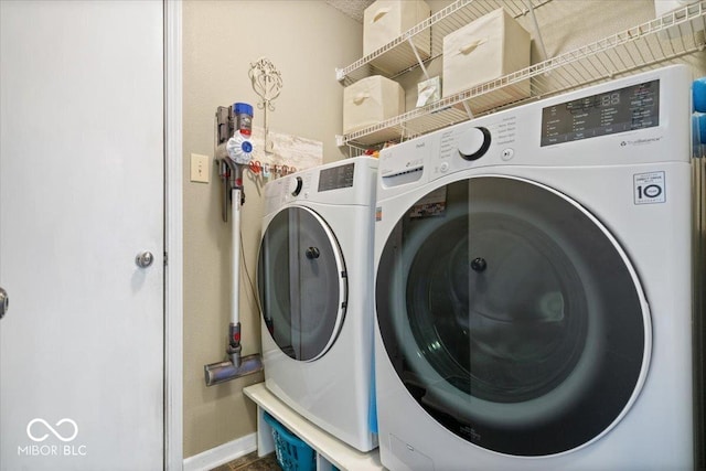 laundry room featuring laundry area and washer and clothes dryer