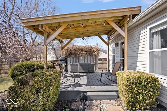 wooden terrace with a gazebo and fence