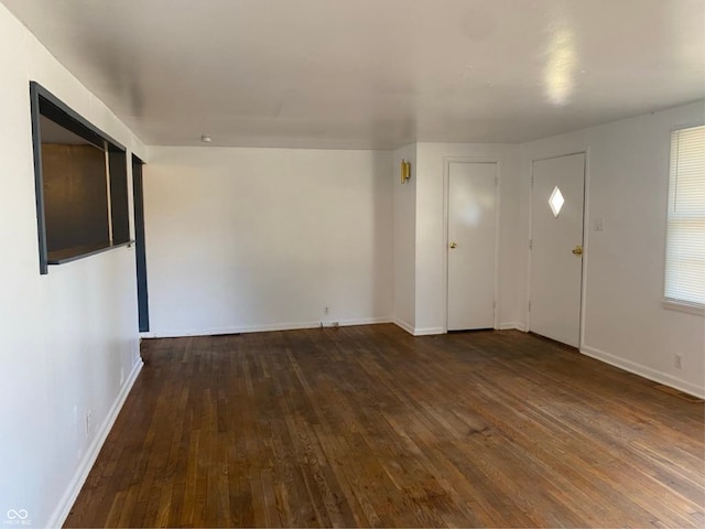 entrance foyer with wood-type flooring and baseboards