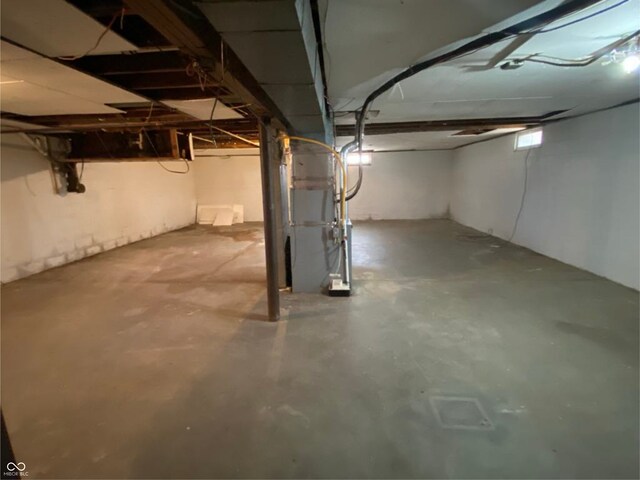 basement featuring heating unit