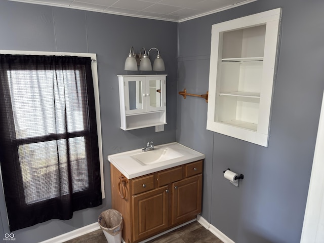 bathroom featuring built in shelves and vanity