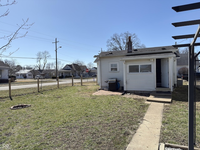 view of yard featuring a residential view and fence