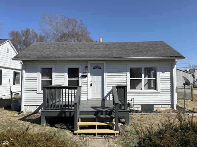 bungalow-style house featuring roof with shingles