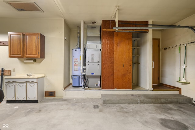 garage featuring visible vents and water heater