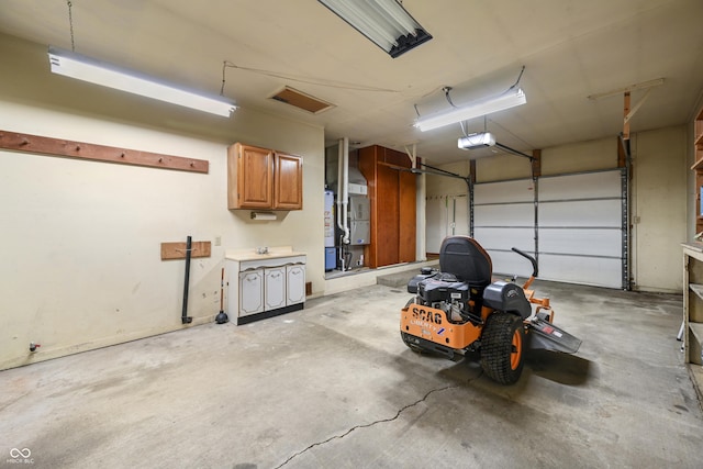 garage featuring heating unit and a garage door opener