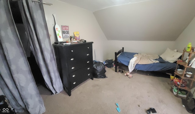 carpeted bedroom featuring vaulted ceiling