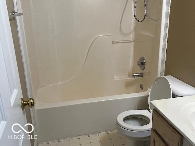 bathroom with shower / washtub combination, vanity, toilet, and tile patterned floors