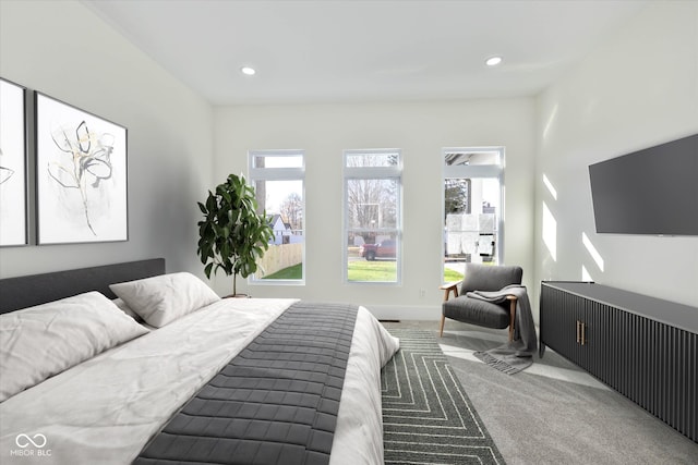 carpeted bedroom with recessed lighting and baseboards