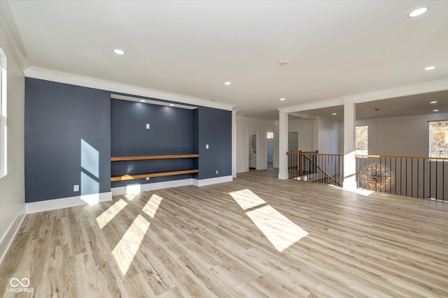 empty room featuring recessed lighting, wood finished floors, baseboards, and ornamental molding