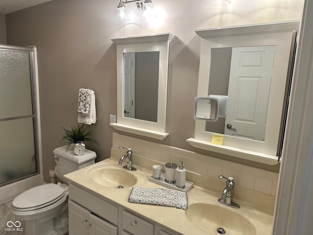 full bathroom featuring a sink, tasteful backsplash, and toilet