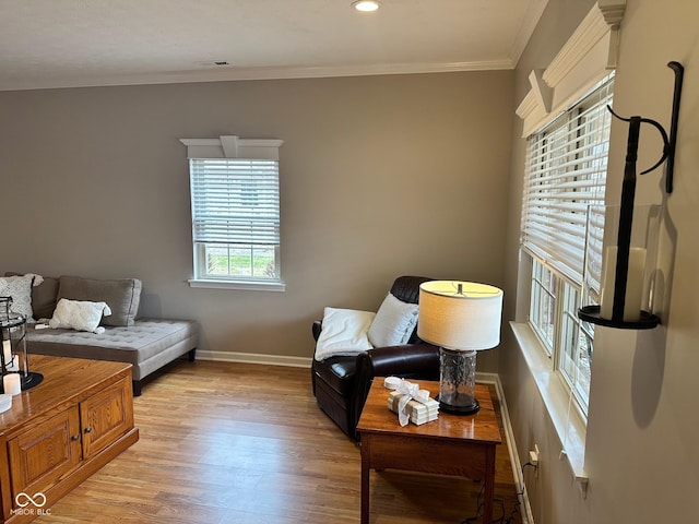 sitting room featuring visible vents, recessed lighting, light wood-style floors, crown molding, and baseboards